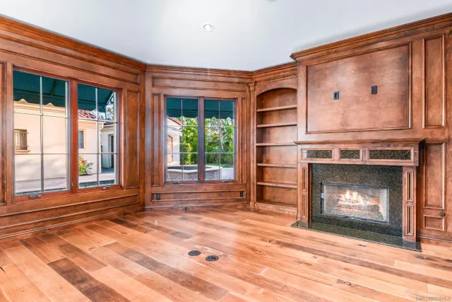 a front view of a house with a lot of flower plants