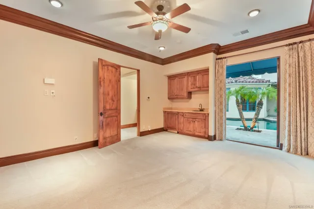 an aerial view of a house with a yard basket ball court and outdoor seating