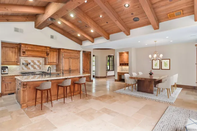 a living room with furniture and large windows