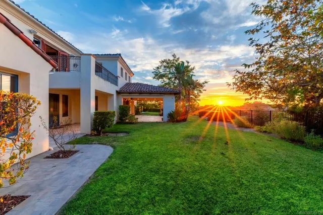 a view of a swimming pool with sitting area