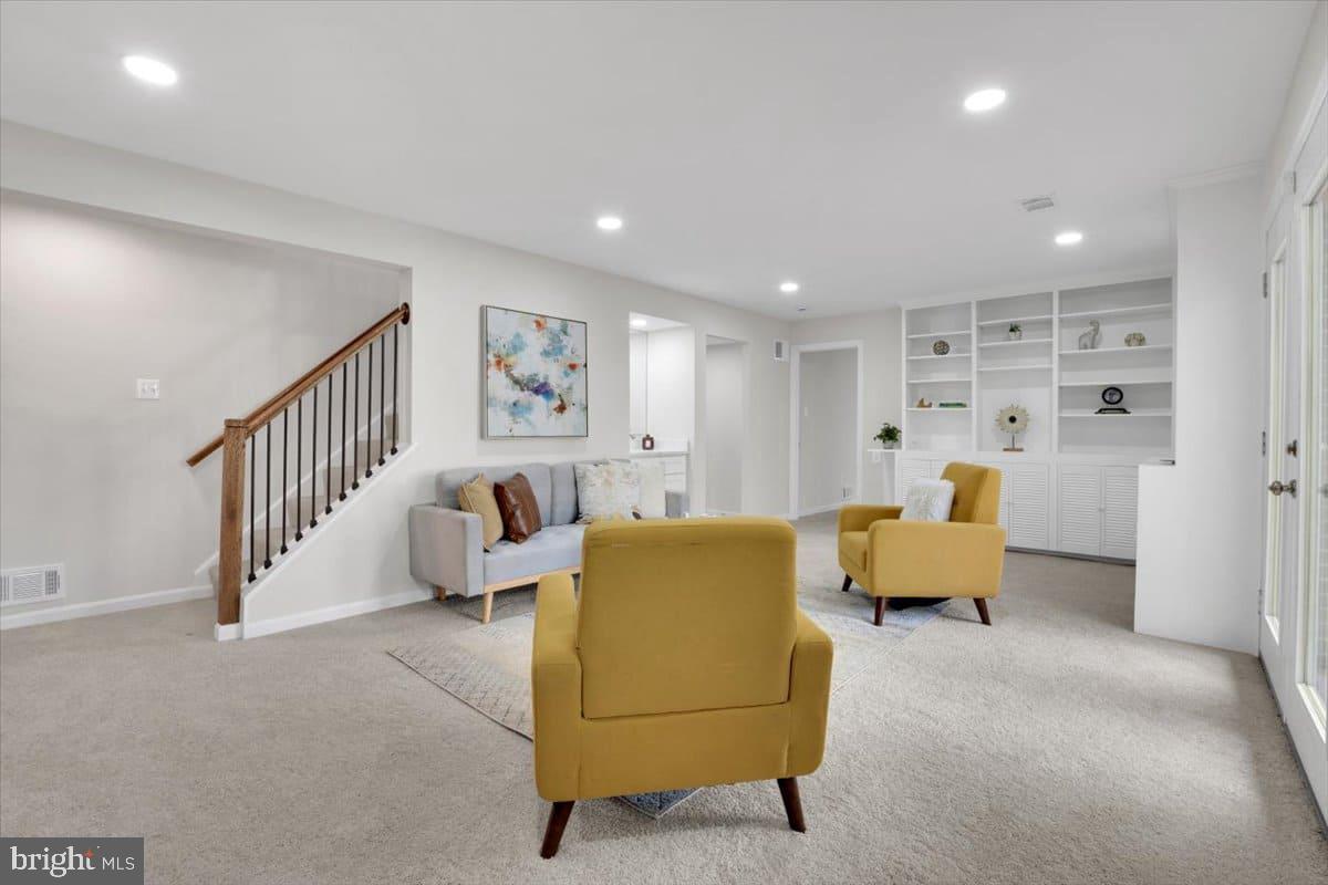 7217 Willow Oak Place Springfield, VA 22153 - Photo 16 of 31 a living room with furniture and white walls