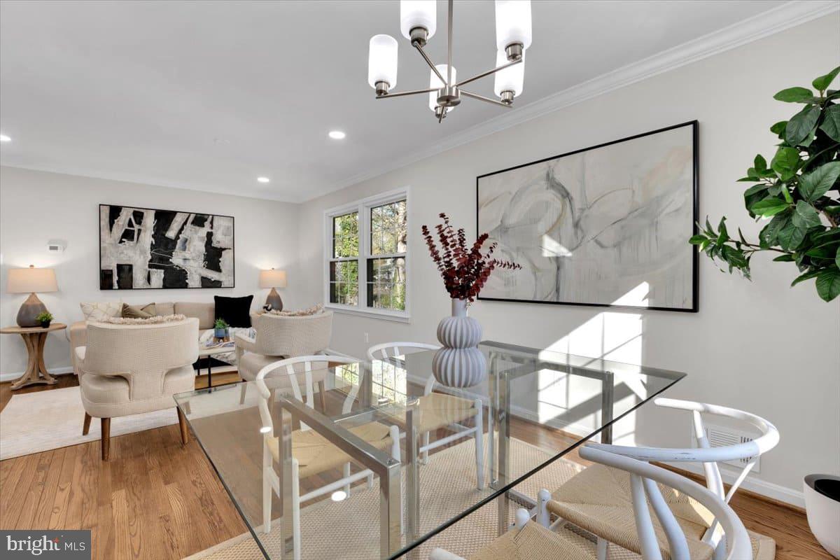 7217 Willow Oak Place Springfield, VA 22153 - Photo 3 of 31 a living room with furniture and a chandelier