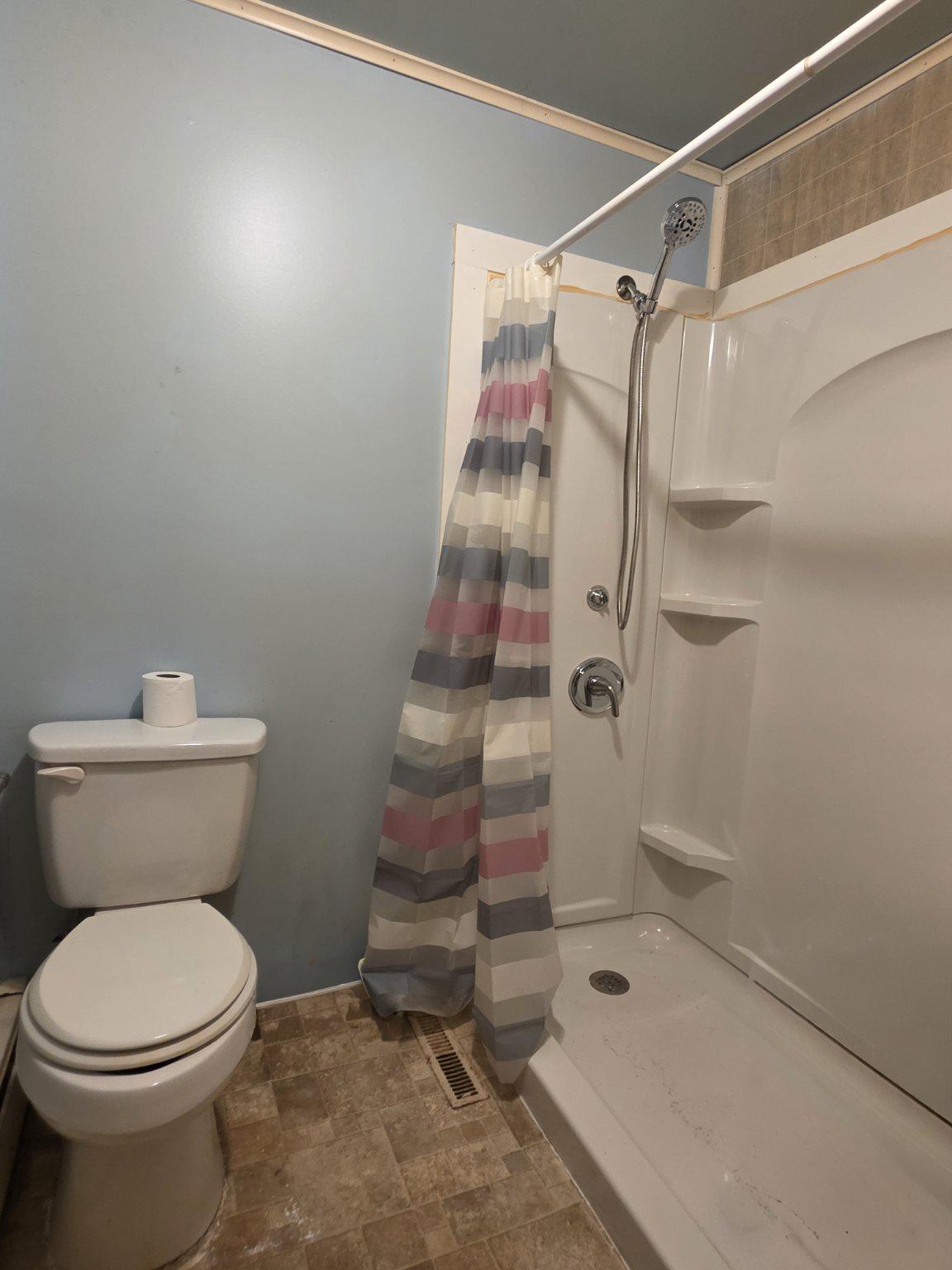 1128 Pearsons Corner Road Hartly, DE 19953 - Photo 46 of 63 1st floor bathroom with stall shower