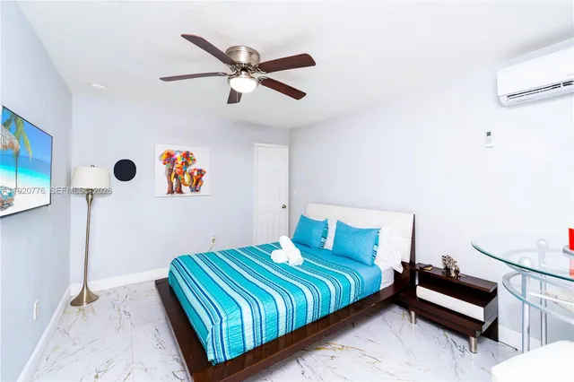 a bathroom with a sink toilet vanity and shower