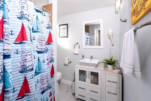 a bedroom with a bed next to a window with the outer view