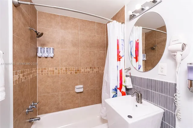 a large bedroom with bed and window