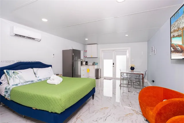 a bathroom with a granite countertop sink mirror and toilet