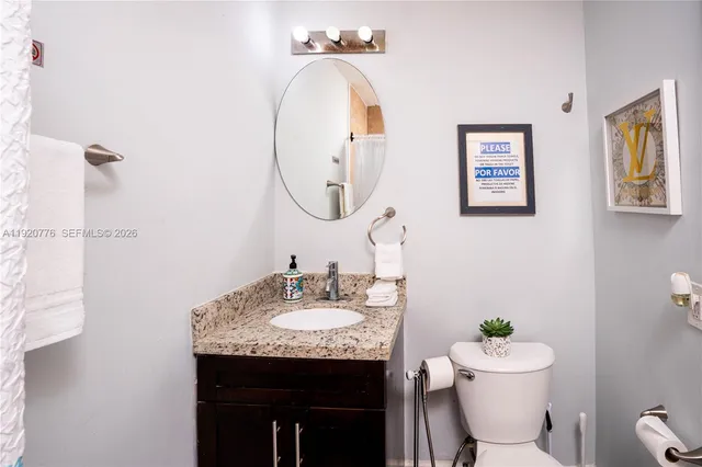 a view of a dining room with furniture wooden floor and a chandelier