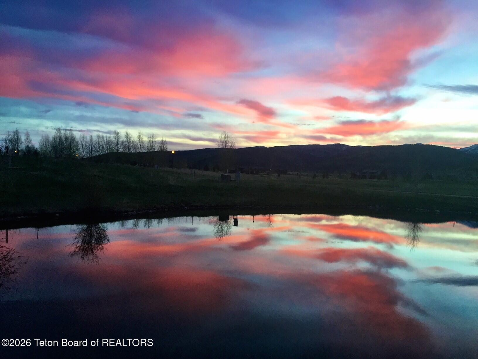 31 Bannock Circle Victor, ID 83455 - Photo 39 of 42 lodge home pink sky reflections over pon