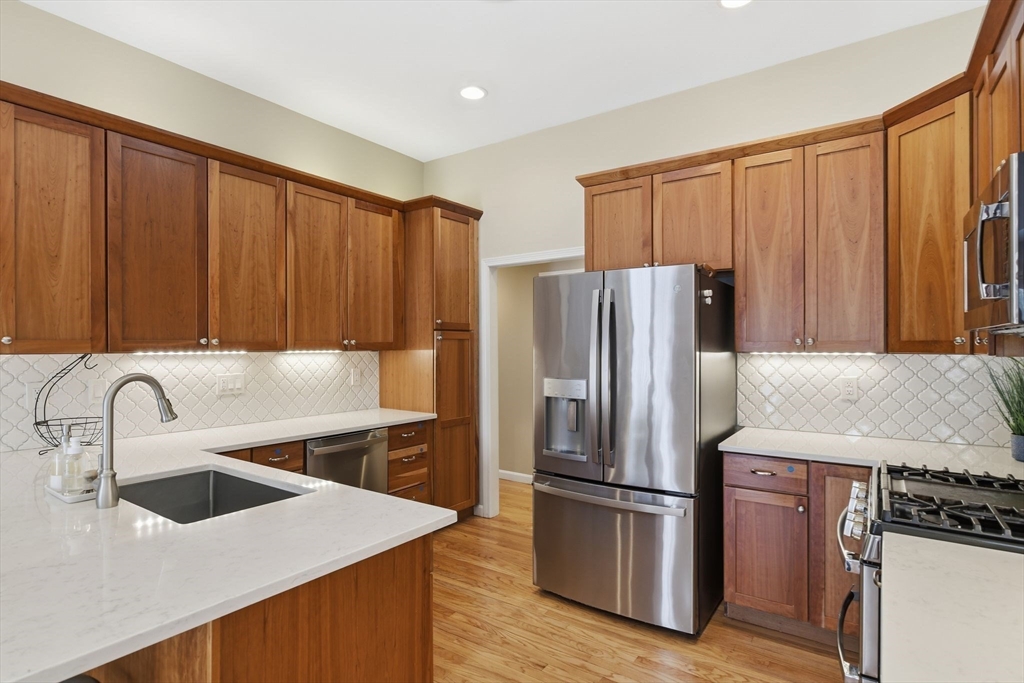6 Shattuck Road Hadley, MA 01035 - Photo 15 of 40 a kitchen with stainless steel appliances granite countertop a refrigerator a sink and a stove