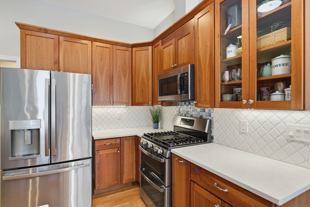 6 Shattuck Road Hadley, MA 01035 - Photo 16 of 40 a kitchen with stainless steel appliances granite countertop a refrigerator stove and sink