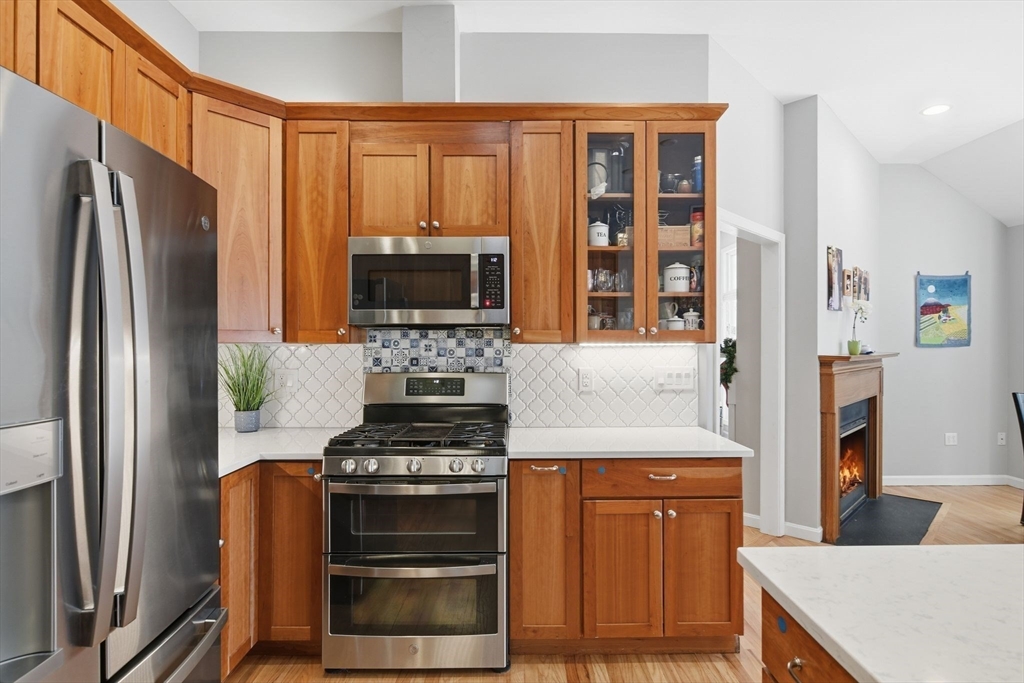 6 Shattuck Road Hadley, MA 01035 - Photo 19 of 40 a kitchen with stainless steel appliances a stove a refrigerator and a microwave