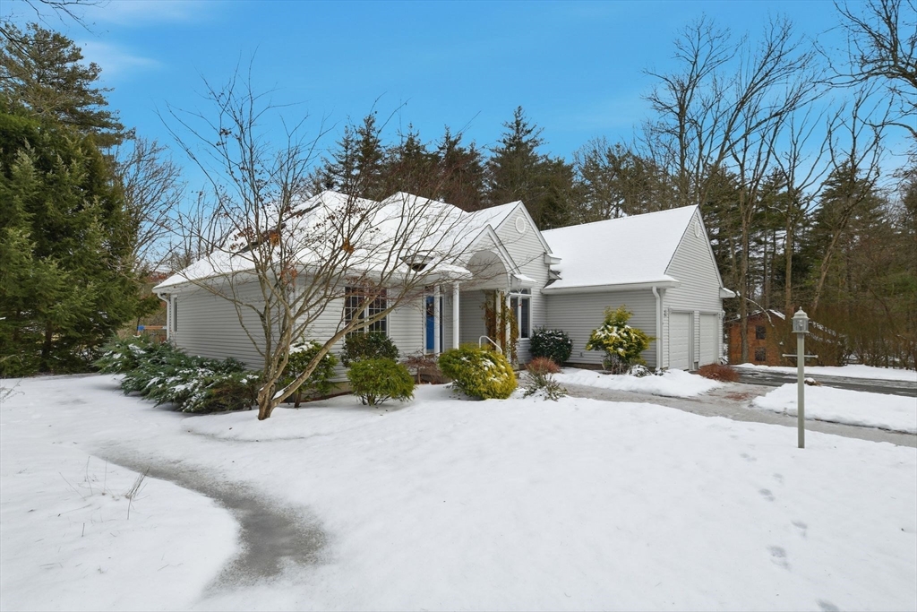 6 Shattuck Road Hadley, MA 01035 - Photo 2 of 40 a front view of a house with a yard and garage