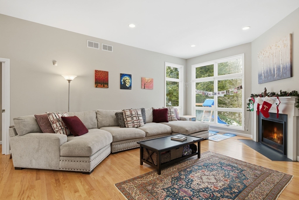 6 Shattuck Road Hadley, MA 01035 - Photo 7 of 40 a living room with furniture fireplace and a large window