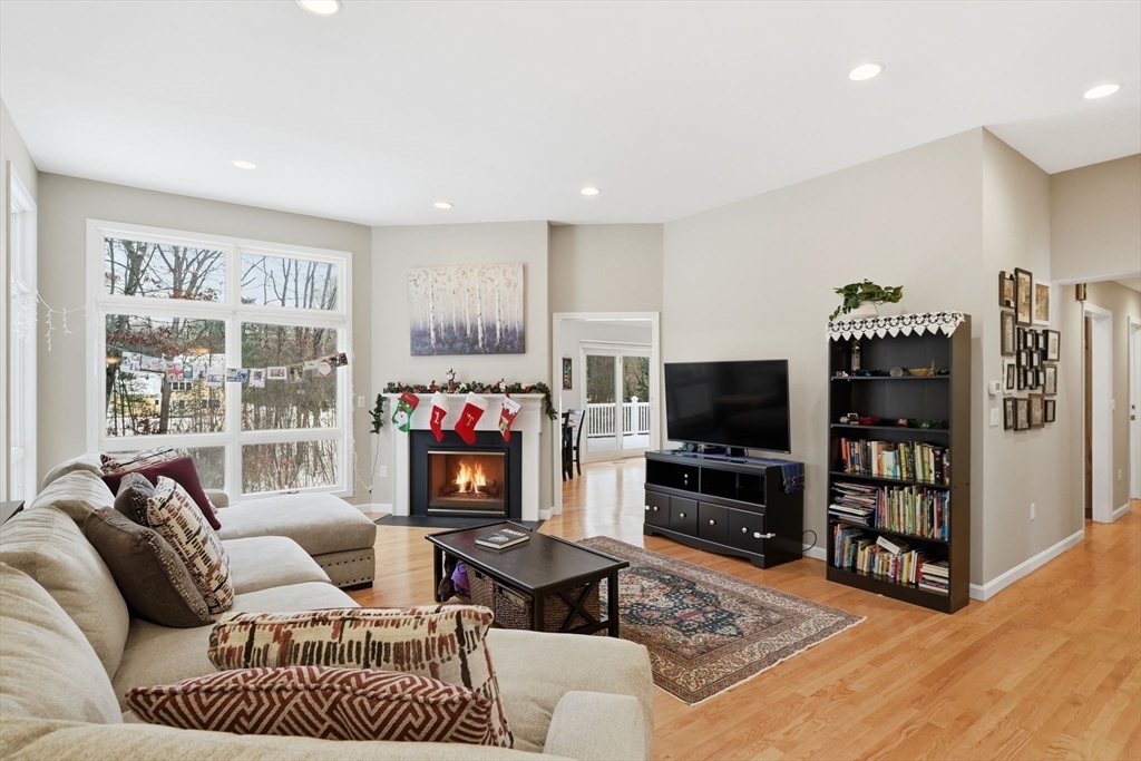 6 Shattuck Road Hadley, MA 01035 - Photo 9 of 40 a living room with furniture a flat screen tv and a fireplace