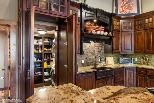 a room with pool tables and a chandelier