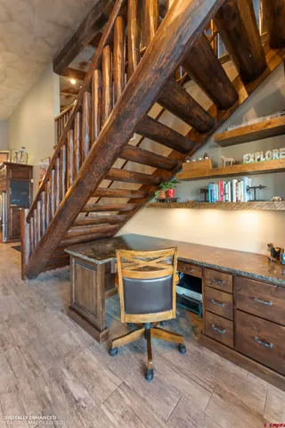 a spacious bedroom with a bed and a large mirror