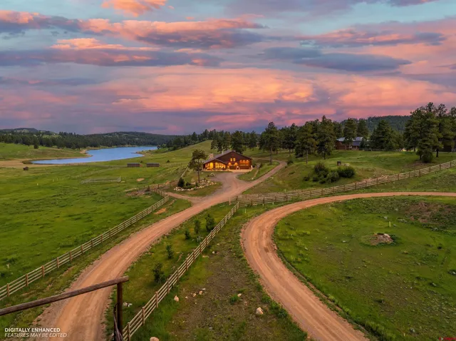 a dining room with furniture entryway and wooden floor