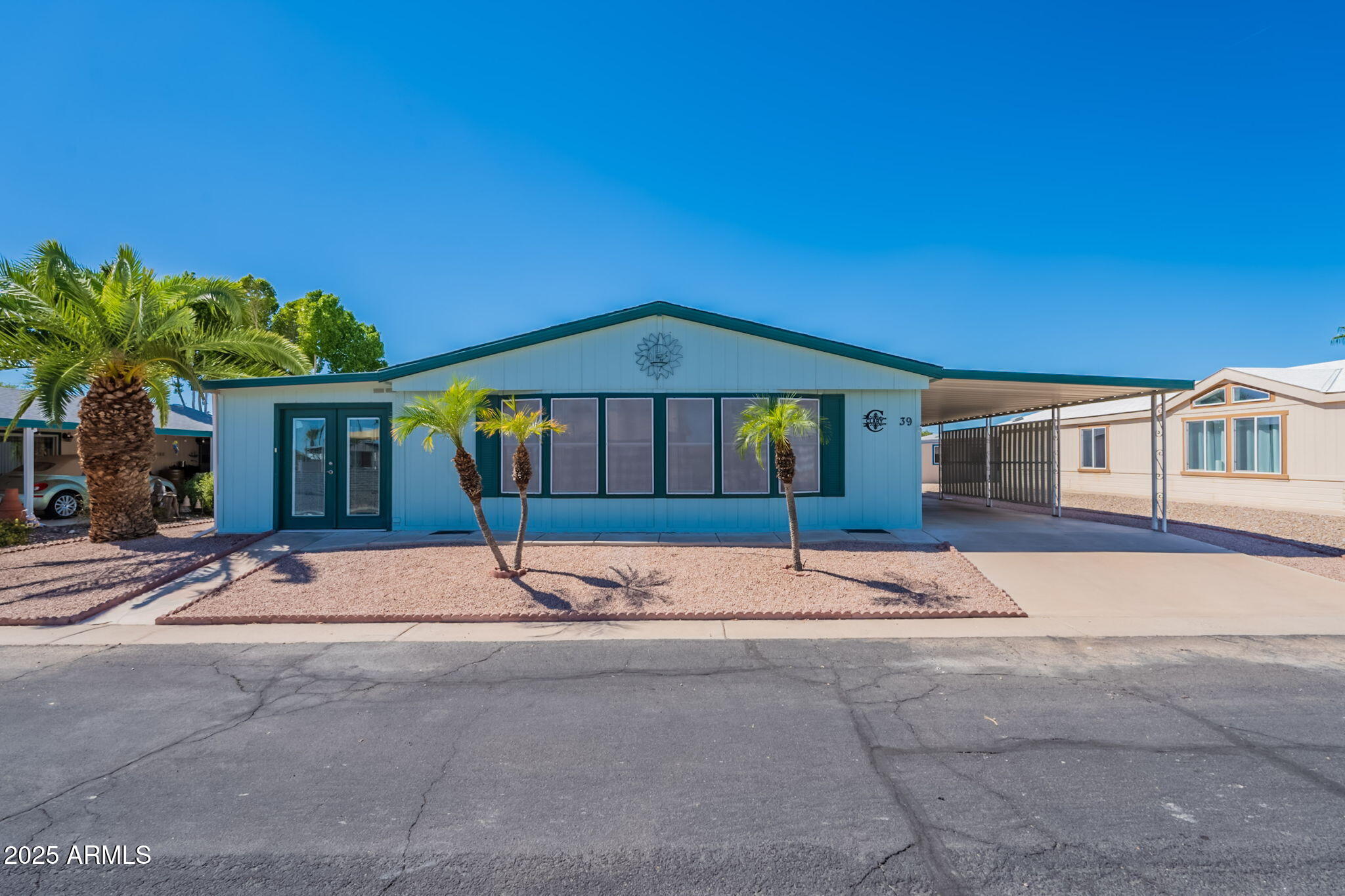 3700 South Tomahawk Road, Unit 39 Apache Junction, AZ 85119 - Photo 10 of 53 a house with a yard in front of it