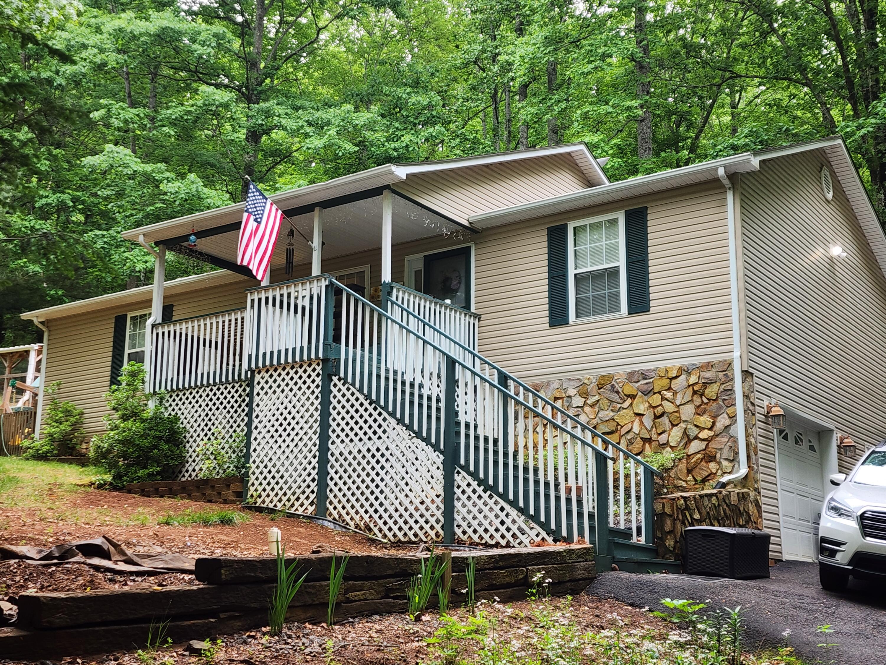 a side view of a house with a yard