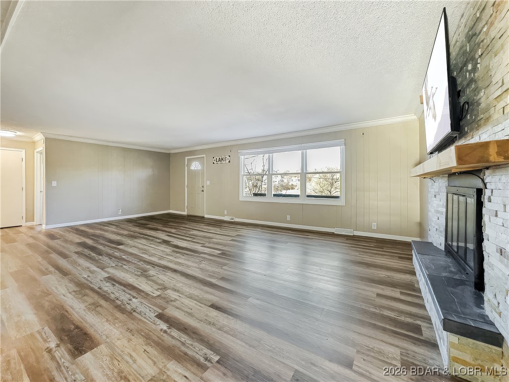 160 Bridgeview Road Camdenton, MO 65020 - Photo 12 of 49 Gas fireplace with stone surround will help warm a