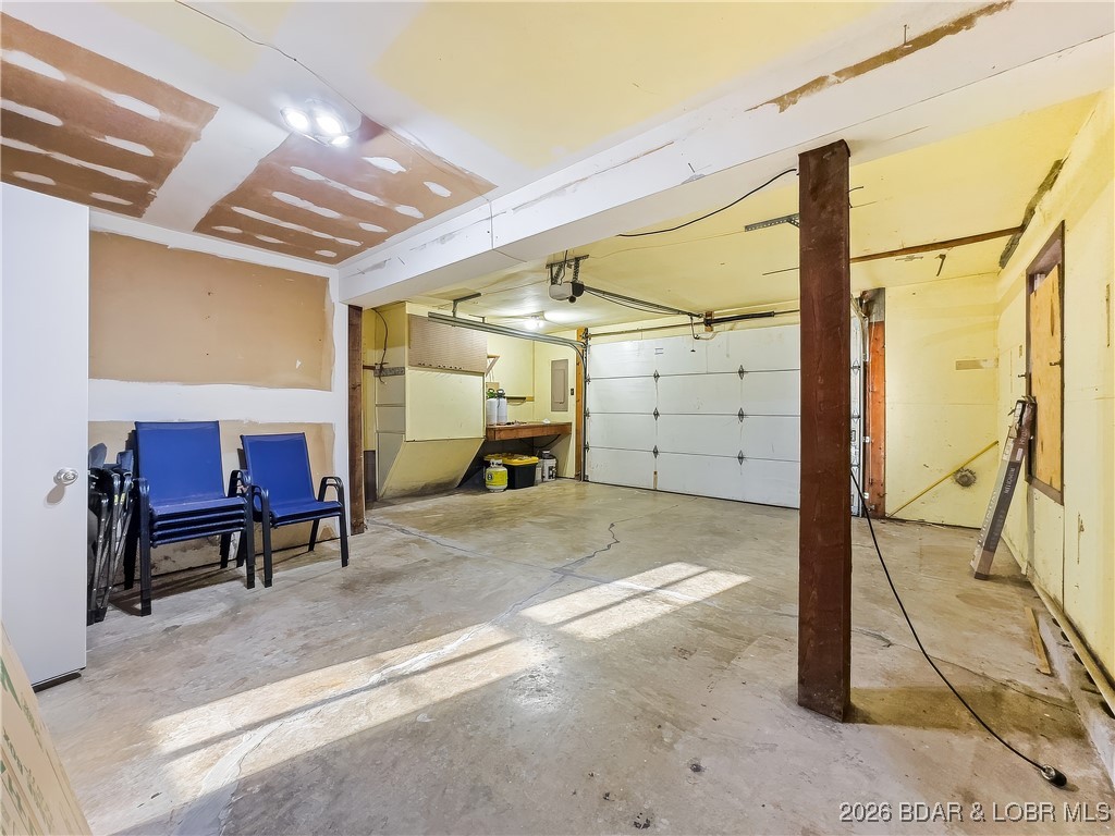 160 Bridgeview Road Camdenton, MO 65020 - Photo 37 of 49 1-car garage with extra storage area.