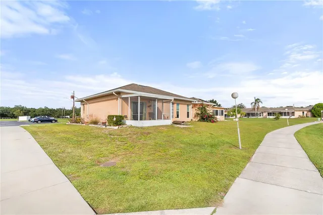a swimming pool view with a outdoor seating