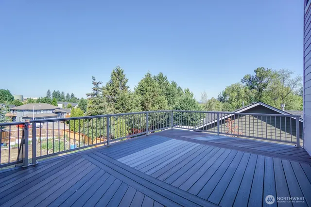 a view of balcony with wooden floor