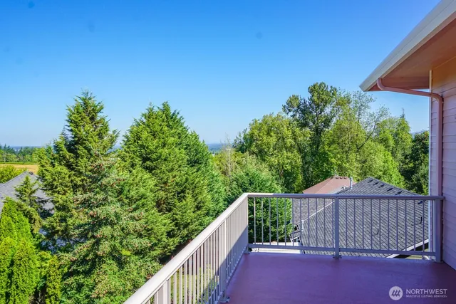 a balcony with trees in front of it
