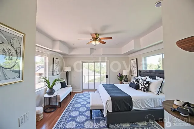 a bed room with a bed and a chandelier