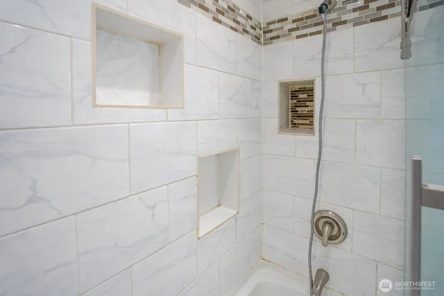 an empty room with closet and entryway