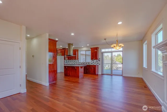 a view of kitchen with refrigerator and window