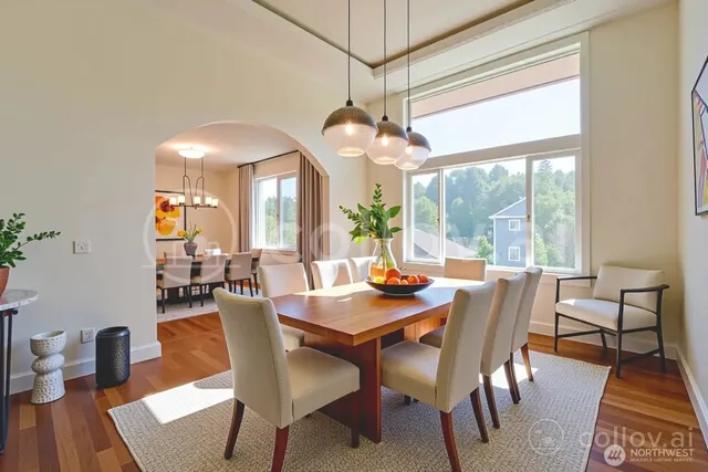 a view of a dining room with furniture window and wooden floor