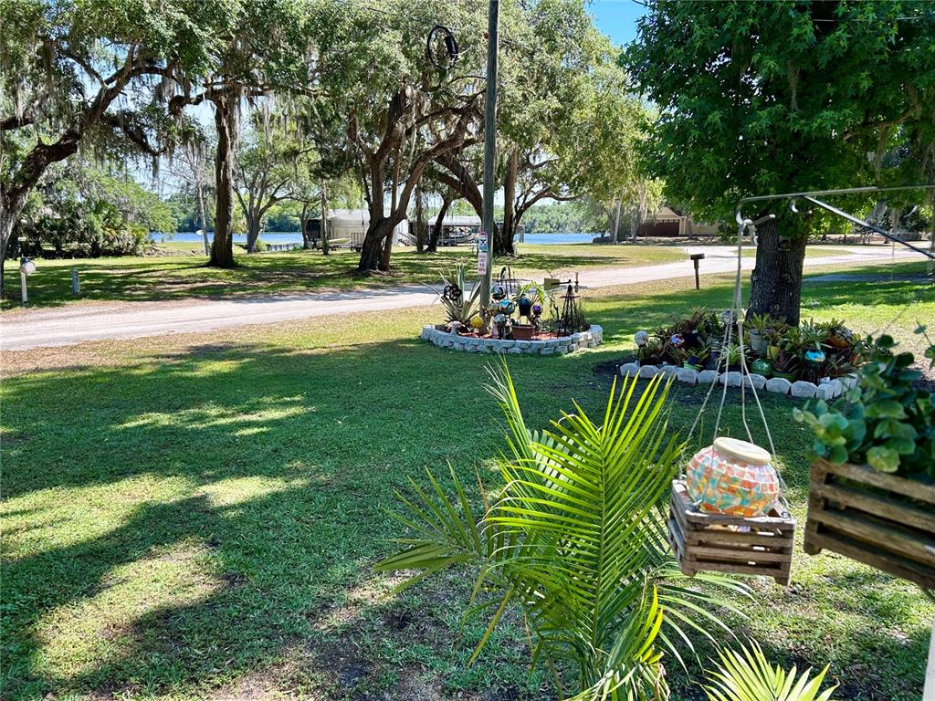 25646 Bass Road Astor, FL 32102 - Photo 4 of 48 a view of a swimming pool with a patio