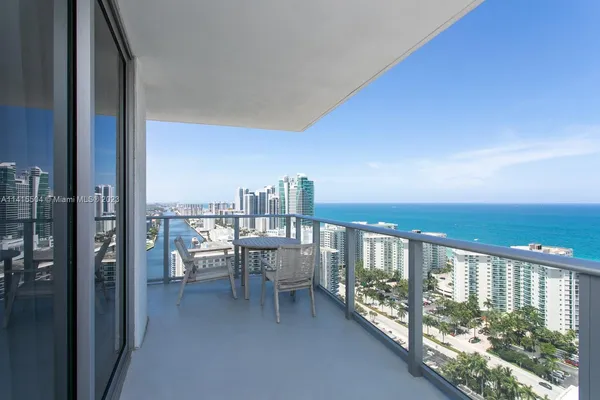 a view of a balcony with chairs