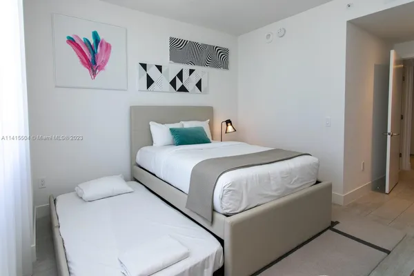 a bedroom with a bed and closet
