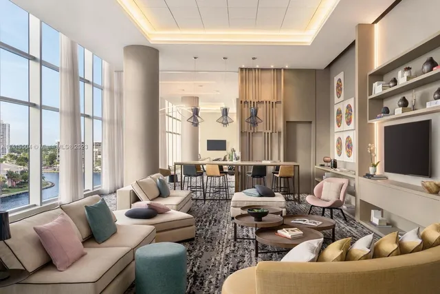 a living room with furniture and large windows