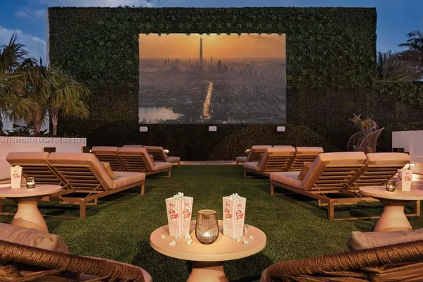 a view of a patio with couches chairs and a fire pit