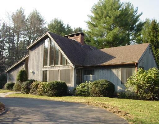 155 Mountain Road Redding, CT 06896 - Photo 1 of 1 a view of a white house next to a yard with large trees