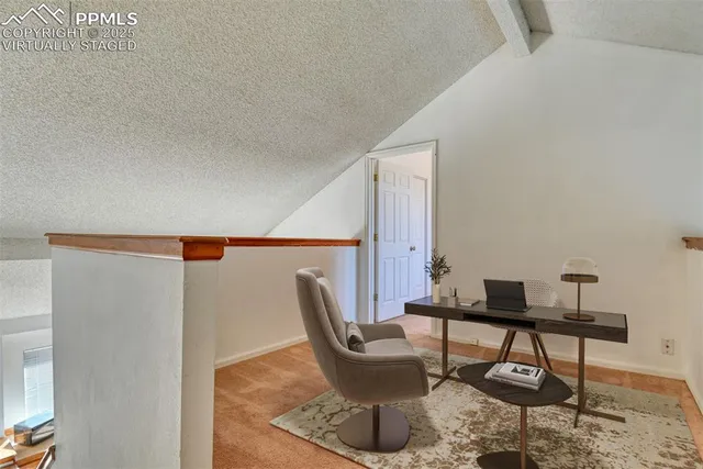 a workspace with furniture and window