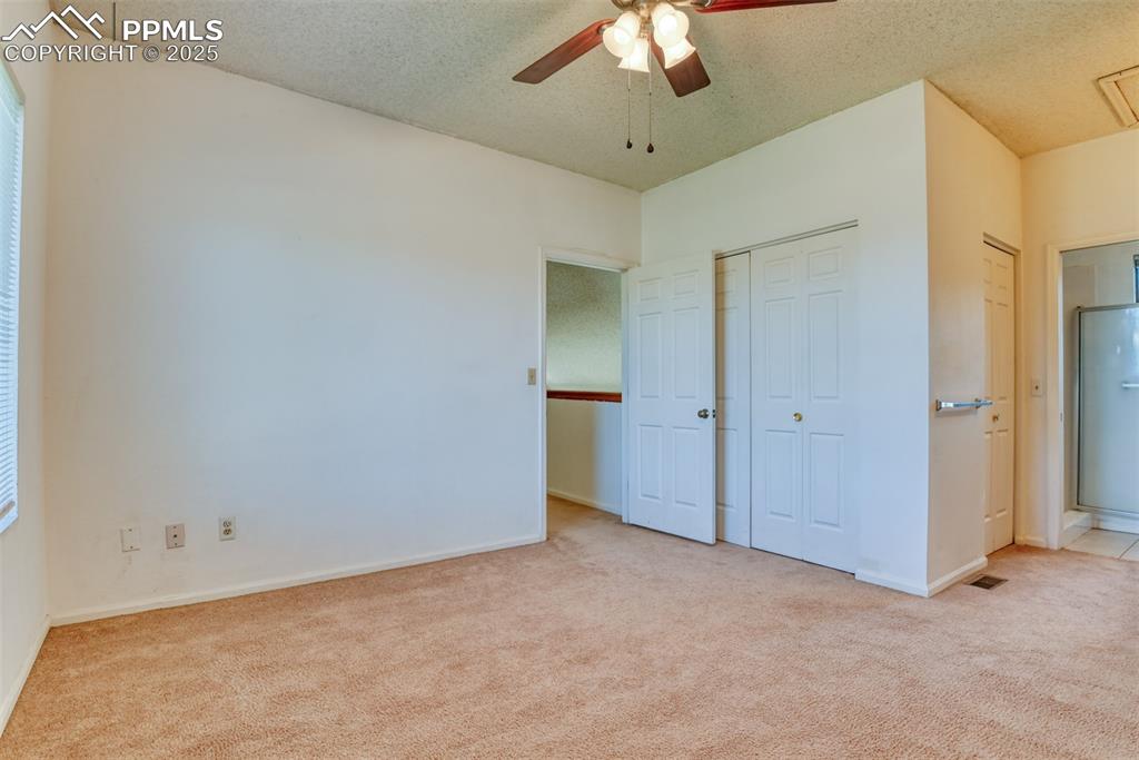 St, Unit A Colorado Springs, CO 80906 - Photo 14 of 37 a view of an empty room with a chandelier fan