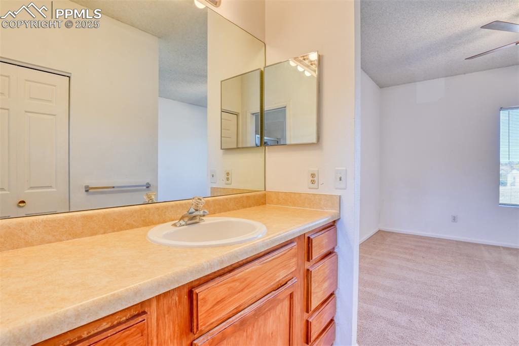 St, Unit A Colorado Springs, CO 80906 - Photo 31 of 37 a bathroom with a sink and a mirror