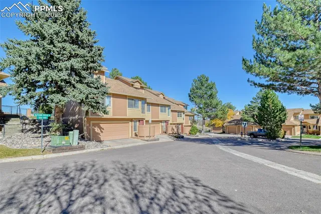 a front view of a house with a yard and porch
