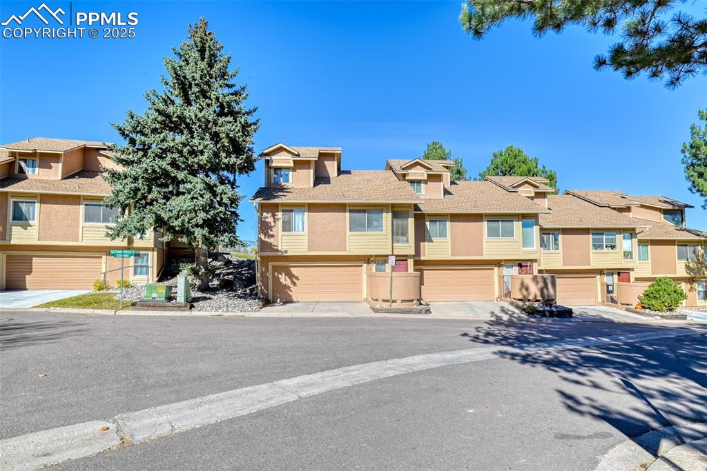 St, Unit A Colorado Springs, CO 80906 - Photo 34 of 37 a front view of a building with streets and trees