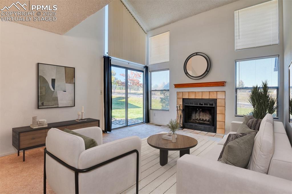 St, Unit A Colorado Springs, CO 80906 - Photo 4 of 37 a living room with furniture and a fireplace