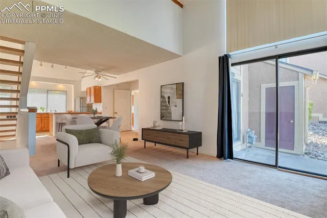 a living room with furniture and a table