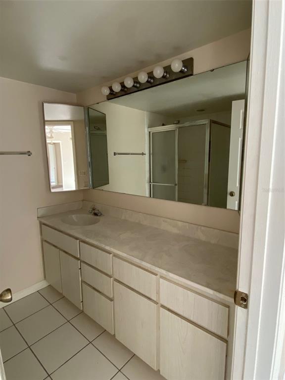2911 Pecan Avenue Leesburg, FL 34748 - Photo 12 of 26 a bathroom with a sink and a mirror