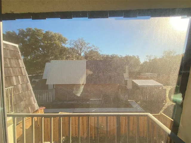 a view of a balcony with chair and floor