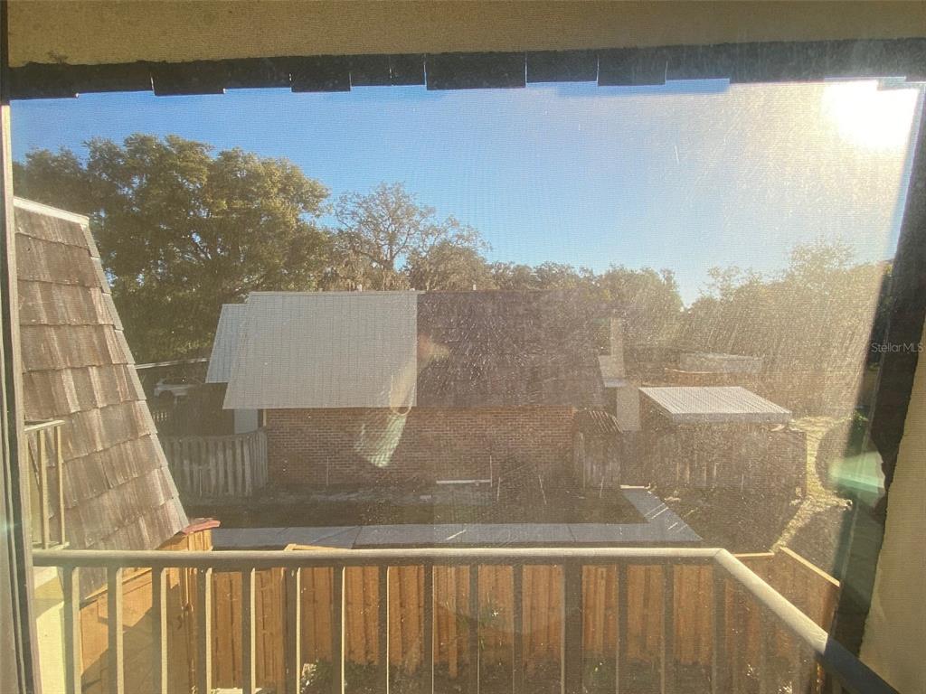 2911 Pecan Avenue Leesburg, FL 34748 - Photo 15 of 26 a view of a balcony with chair and floor