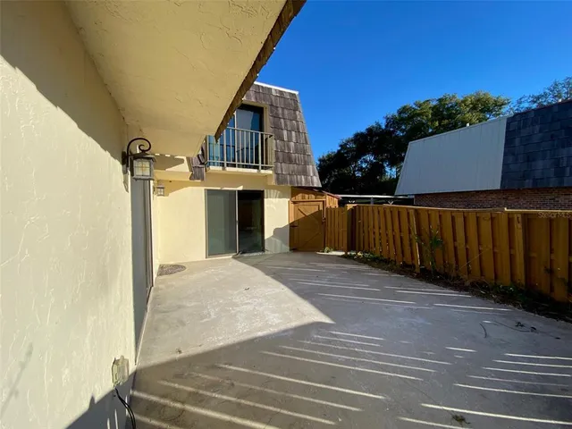 a view of a house with a backyard and a garage